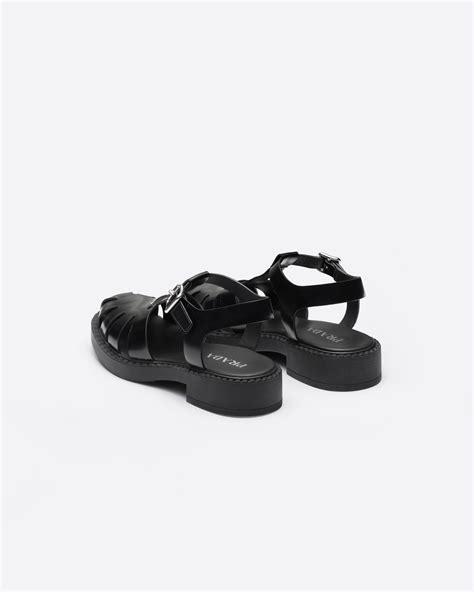 prada black leather fisherman sandals.